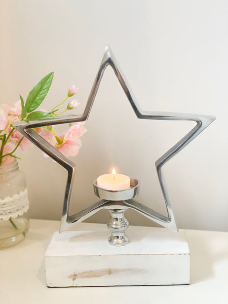 Silver Star Tea-Light Holder On White Wooden Base